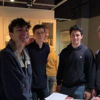 Five students standing in a kitchen museum exhibit in the Arab American Museum